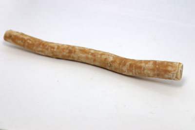 High angle view of bread on table against white background