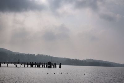 Scenic view of mountains against cloudy sky