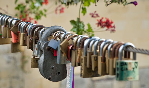 Close-up of padlocks on railing