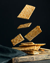 Creative concept with falling food on black backdrop