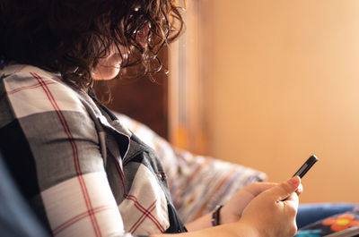 Midsection of woman using smart phone