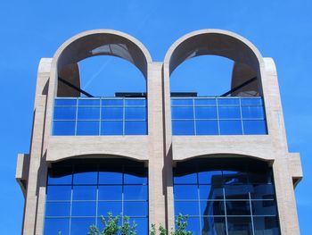 Low angle view of building against blue sky