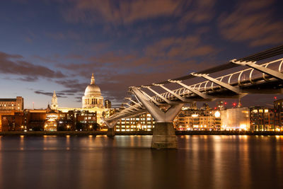 Illuminated buildings in city at waterfront