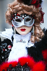 Woman wearing venetian mask 