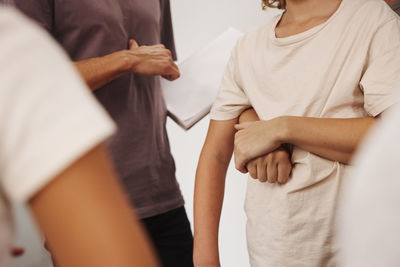 Teachers and children in first aid class