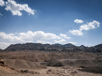 Scenic view of arid landscape against sky