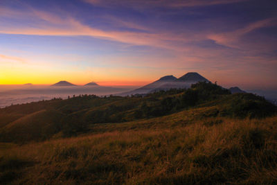 Scenic view of landscape against sky during sunset