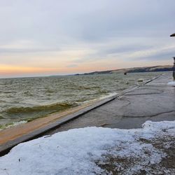 Scenic view of beach against sky during sunset