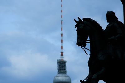 Low angle view of statue against cloudy sky