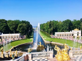 Fountain in park against clear sky