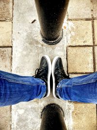 Low section of man standing on floor