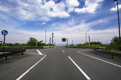 Empty road against sky