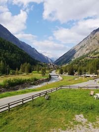 Scenic view of landscape and mountains against sky