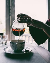 Hand holding tea cup