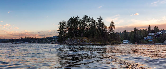 Scenic view of lake against sky during sunset