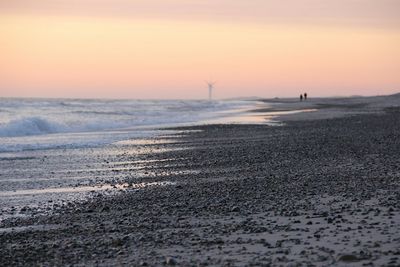 Scenic view of calm sea at sunset