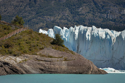 Scenic view of sea against mountain