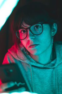 Close-up portrait of woman wearing eyeglasses