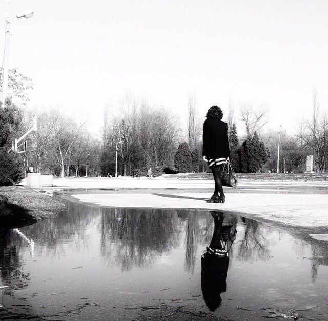 water, tree, lifestyles, full length, rear view, leisure activity, lake, reflection, clear sky, men, casual clothing, standing, waterfront, walking, river, person, nature, season