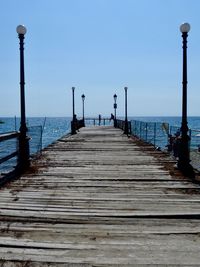 View of pier on sea against sky