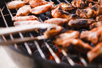 Close-up of meat on barbecue grill