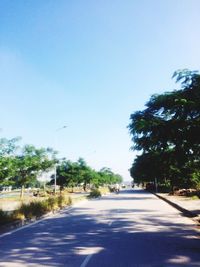 Road in city against clear sky