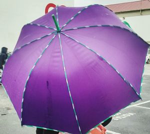 Close-up of pink umbrella against sky