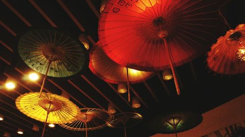 Low angle view of illuminated lanterns at night