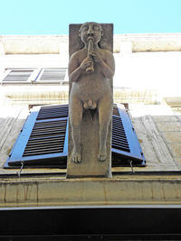 Low angle view of sculpture against clear sky