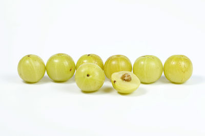 Close-up of fruits over white background