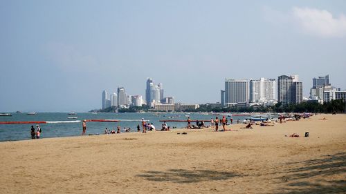 Panoramic view of beach and buildings against sky