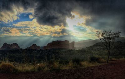 Scenic view of landscape against cloudy sky