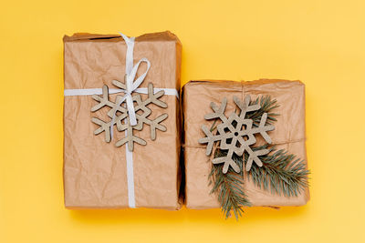 Directly above shot of gift box on yellow background