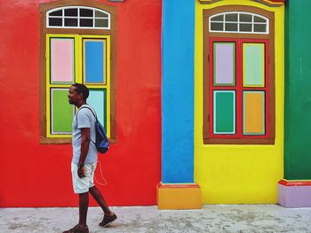 Full length of man standing by window