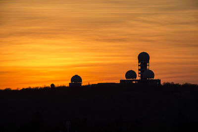 Silhouette of building at sunset