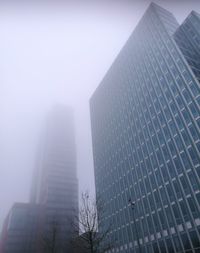 Low angle view of skyscrapers against clear sky