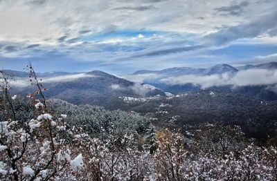 Scenic view of mountains against sky during winter