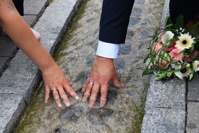 Low section of people walking on footpath