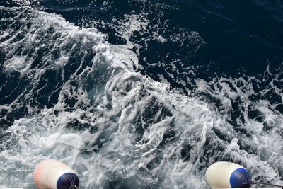 High angle view of waves splashing in sea