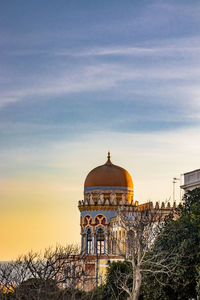 Building against sky during sunset