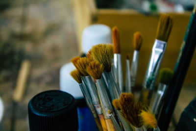 Close-up of paintbrushes on table