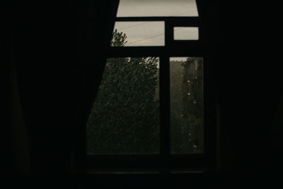 Close-up of window in dark room