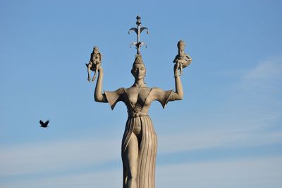 Low angle view of built structure against blue sky