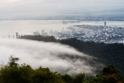 Aerial view of cityscape against sky