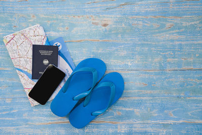 High angle view of shoes on table against wall