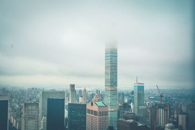 Modern buildings in city against sky