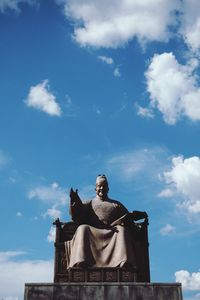 Low angle view of statue against sky