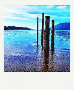 Scenic view of sea against blue sky