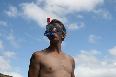 Portrait of shirtless man at the seaside