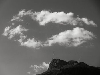 Low angle view of mountain against cloudy sky